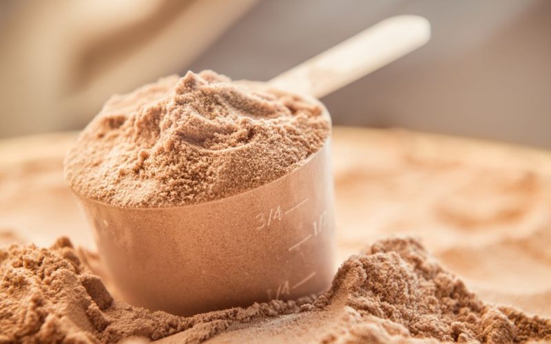 chocolate-whey-protein-powder-with-a-filled-scoop-royalty-free-image-1588179275